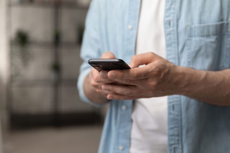 a man using his phone to make a call